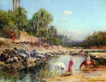 Figures debout par une caravane Victor Huguet orientaliste Peinture à l'huile